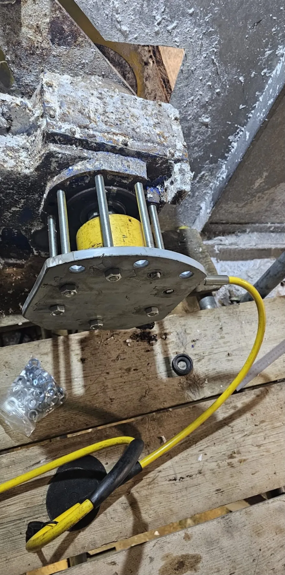 A pulper bearing cartridge stripped down on the workbench for inspection and rebuild.